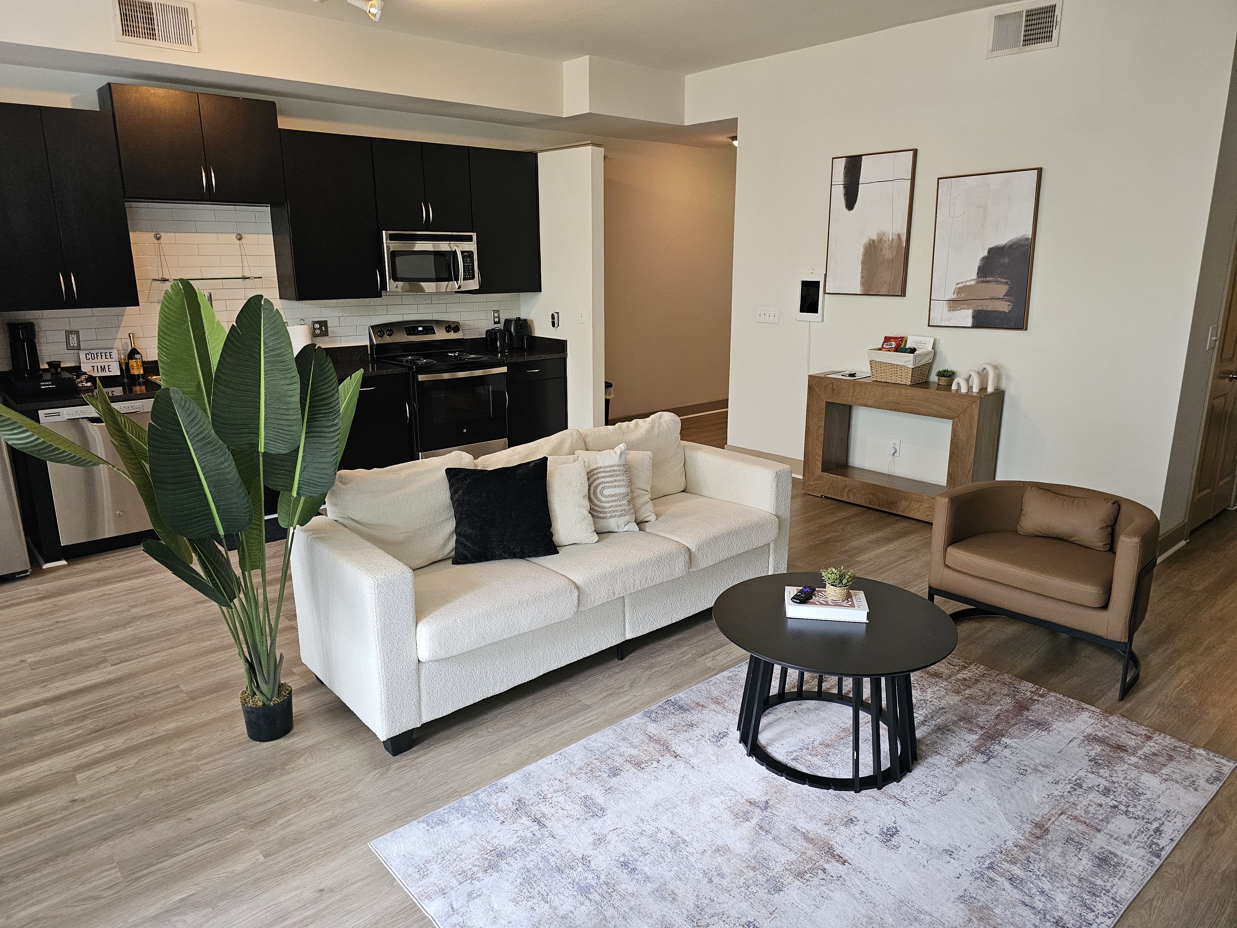 Pristine, staged living room and kitchen after a professional turnover clean